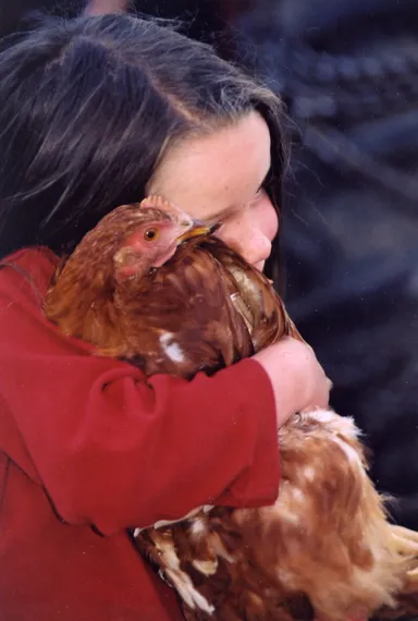 Little girl with hen