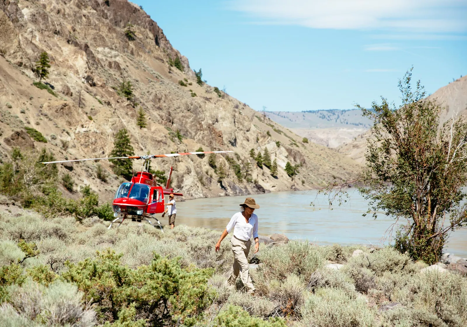 Desert walk in the mighty Fraser river canyon with helicopter waiting nearby