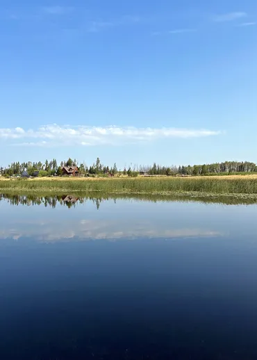 A panoramic western vista of the ranch overlooking Siwash Lake