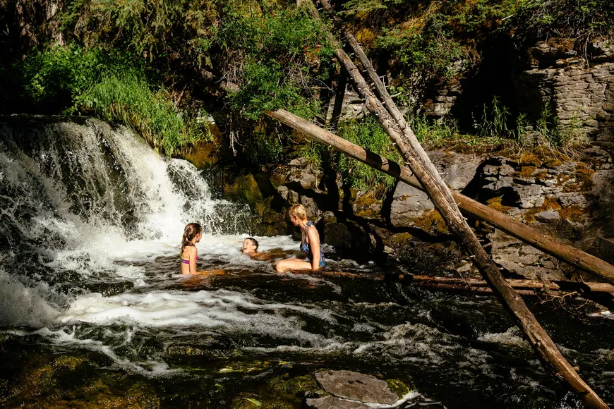 Find your wild as a family with some wild swimming under waterfalls